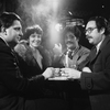Al Carmines, Irene Fornes, Harry Koutoukas, and Larry Kornfield sitting around a table at Caffe Cino before performance of "The White Whore and the Bit Player," by Tom Eyen