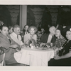 Unidentified diners at table (female on right has white flower in hair) at the nightclub Billy Rose's Diamond Horseshoe.