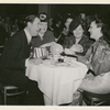 Arthur Treacher and three unidentified women dining at the nightclub Billy Rose's Diamond Horseshoe.