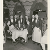 Unidentified female diners and array of waiters around table at the nightclub Billy Rose's Diamond Horseshoe.
