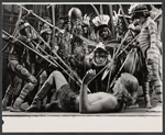 Ted LePlat [lying supine] and unidentified others in the stage production The Leaf People