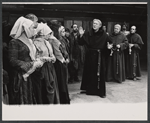 Albert Dekker [center], Patrick Hines, Michael Lombard [right] and unidentified others in the stage production The Devils
