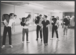 Michael Kidd [center] and unidentified others in rehearsal for the stage production Lil' Abner
