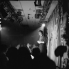 Robert Patrick (on stage) and Neil Flanagan (seated, laughing) during performance of "Palm Sunday Spectacular", aka Spring Fest 66, at Caffe Cino