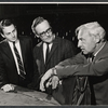 Film critic/playwright Saul Bellow (right) and unidentified men during rehearsals for the stage production Under the Weather