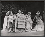 Hiram Sherman [foreground left], Dino Narizzano [foreground right], Eulalie Noble [seated background right wearing dark dress], Inga Swenson [seated middle ground right wearing light dress] and unidentified others in the 1959 American Shakespeare production of A Midsummer Night's Dream