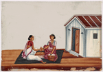 Two women sitting in front of baskets, on black rug in front of white building