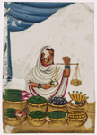 Seated female fruit vendor in white sari holding a balance