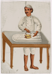 Male servant ironing on table