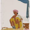 Seated male silversmith/jewelrymaker in front of small jewellry and tools