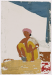 Seated male silversmith/jewelrymaker in front of small jewellry and tools