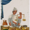 Male spice/salt vendor holding a balance