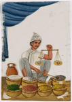 Male spice/salt vendor holding a balance