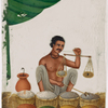 Seated male spice/salt vendor holding a balance