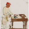 Man in white ironing at table