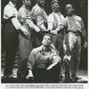 Jeffrey Sams, Kevin Ramsey, Doug Eskew, Milton Craig Nealy, Glenn Turner, and Jerry Dixon (seated) in the stage production Five Guys Named Moe.