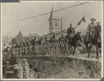 “American troops marching across a bridge"