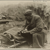 “Soldier offering wounded comrade a cigarette…”