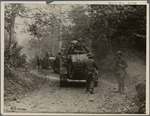“Tanks advancing along a road…”