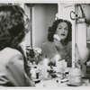 Portrait of actress Hilda Simms in a dressing room applying makeup before a performance, ca. 1940s.