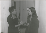 Actress Hilda Simms (right) meeting soprono Leontyne Price, possibly at the time of Price's appearance as Bess in the opera "Porgy and Bess," circa 1953