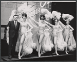Steve Lawrence and showgirls in the stage production Golden Rainbow