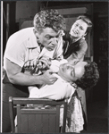 Joseph Sirola [standing holding shirt collar], Roberto Rodriguez [seated] and unidentified in the stage production Song for a Certain Midnight