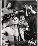 Nick Rawson [background left with guitar], Dave Ringland [foreground with guitar], Elizabeth Herring [standing right with trumpet] and unidentified [with flute] in the 1969 stage production Stomp