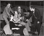 Cole Porter [center], George S. Kaufman [right] and unidentified others in rehearsal for the stage production Silk Stockings