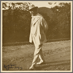 Six photographs of SLC strolling in white suit at Tuxedo, Aug. 1907. SLC walking past camera, profile.