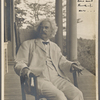 Seven photographs. SLC on a verandah, smoking. Photograph series, "the progress of a moral purpose..." 1 of 7