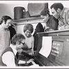Peter Udell [standing left], Gary Geld [seated at piano], Melba Moore [second from right leaning on piano], Cleavon Little [right leaning on piano] and unidentified [holding pen looking at Gary Geld] in rehearsal for the stage production Purlie