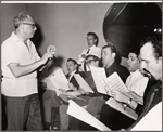 Philip J. Lang [left] and unidentified others in rehearsal for To Broadway with Love