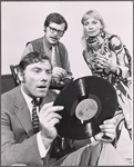 Alan Bergmann [foreground with record], Elizabeth Shepherd [background right] and unidentified [background left] in the stage production The Jumping Fool