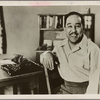 Portrait of writer Langston Hughes with his typewriter