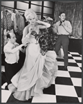 Monique Van Vooren, Jimmy Dean [right] and unidentified in costume fitting for the stage production Destry Rides Again