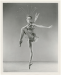 Full-length studio portrait of Tanaquil Le Clercq posing on pointe in costume for "Metamorphosis"