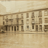 Old tenement row; glimpse of 23rd Police Precinct building