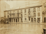 Old tenement row; glimpse of 23rd Police Precinct building