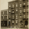 Tenements & industrial building; women & children outside; worker outside Metal Cleaning Co.