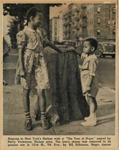 Negroes in New York's Harlem wish at "The Tree of Hope"...The tree's stump was removed to its present site at 131st St., 7th Ave...