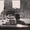 Man with crutches, asleep on the sidewalk. Rear of Grace Church Buildings. 4th Avenue and 10th Street