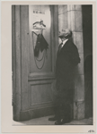 Henry Cowell at entrance to exhibition