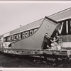 Base unit being loaded on a railroad car