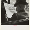 Reading war news aboard streetcar. San Francisco, California