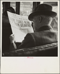Reading war news aboard streetcar. San Francisco, California