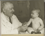 Doctor with a baby in Moscow