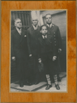Group portrait of New York City firefighter Wesley A. Williams (right) with his father James H. Williams (left), grandfather John Wesley Williams (2nd from left) and son James H. Williams II (in front).
