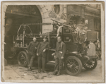 New York City fire fighter Wesley A. Williams, (right) with two of his fellow fire fighters posing with a fire truck at Engine Company No. 55, in Manhattan's Lower East Side