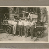 New York City fire fighter Wesley A. Williams (right) with three of his fellow fire fighters posing with a fire truck at Engine Company No. 55, in Manhattan's Lower East Side